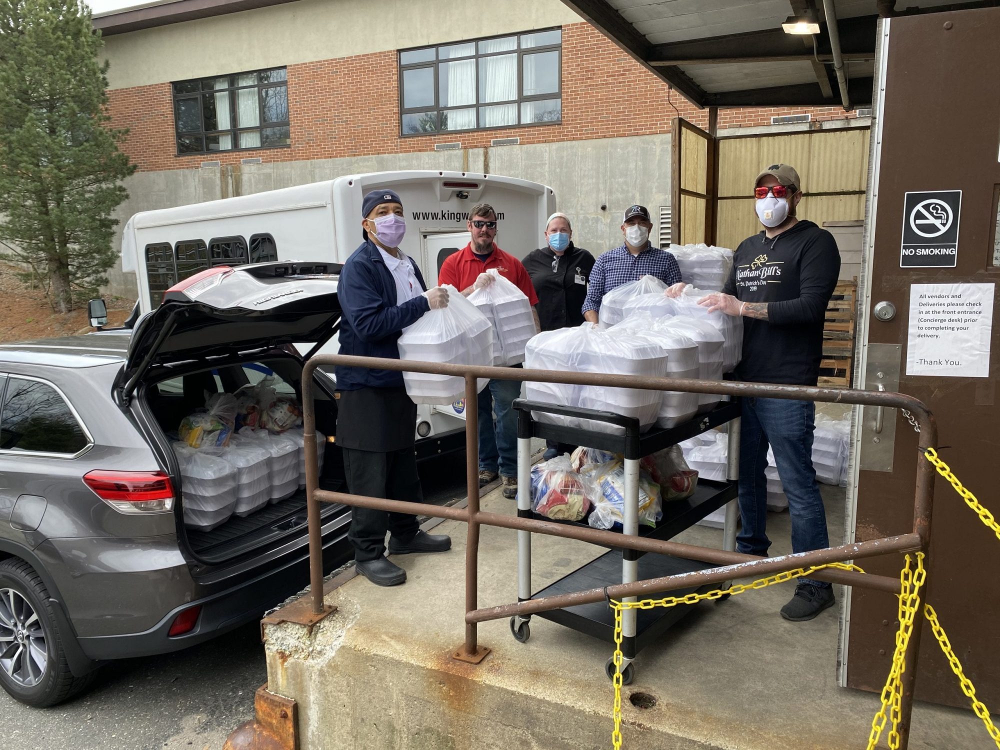 Men delivering food to an elder care facility