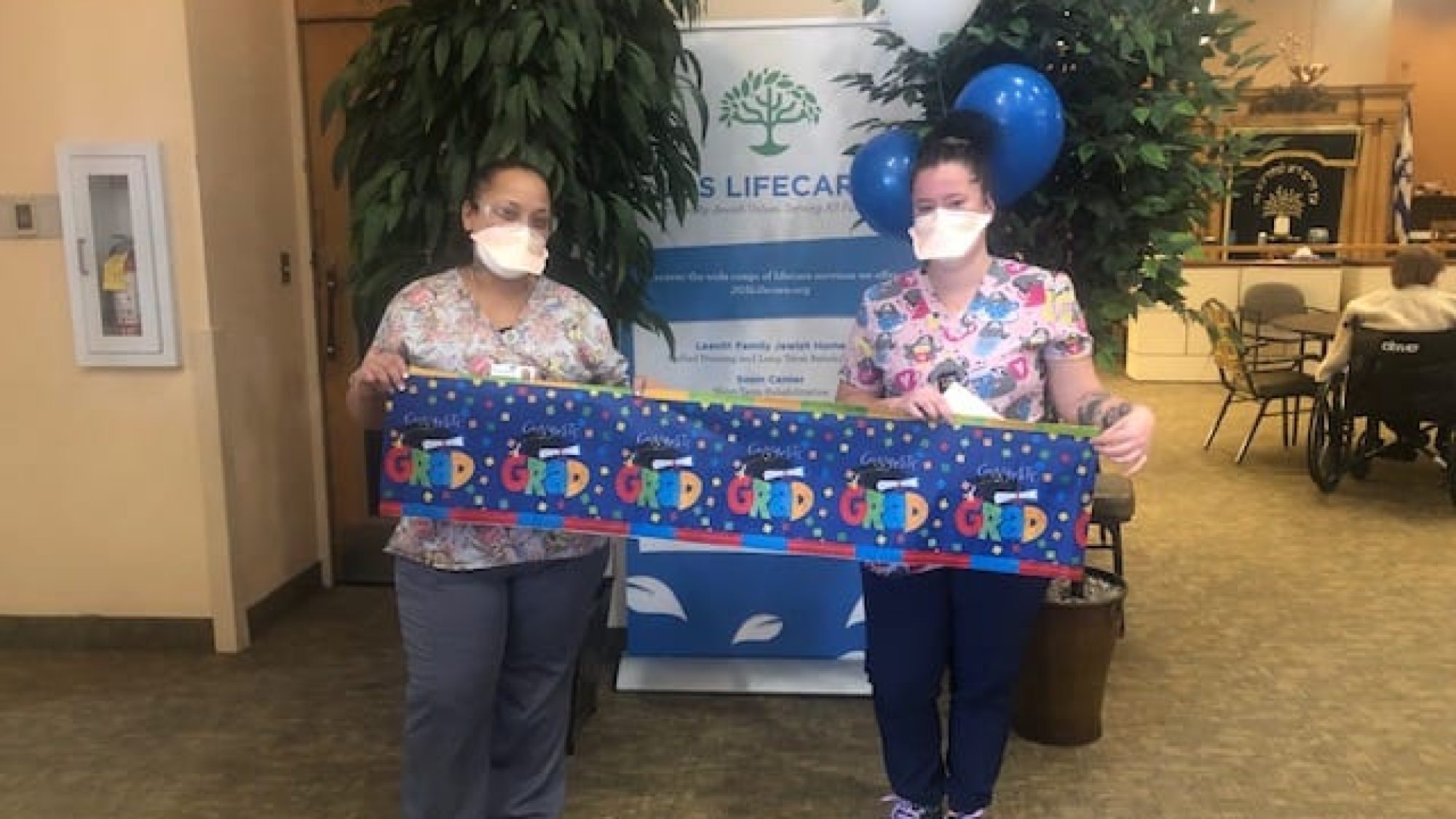 Olga and Rosaly celebrating their graduation from Temporary Nurse Aid training.