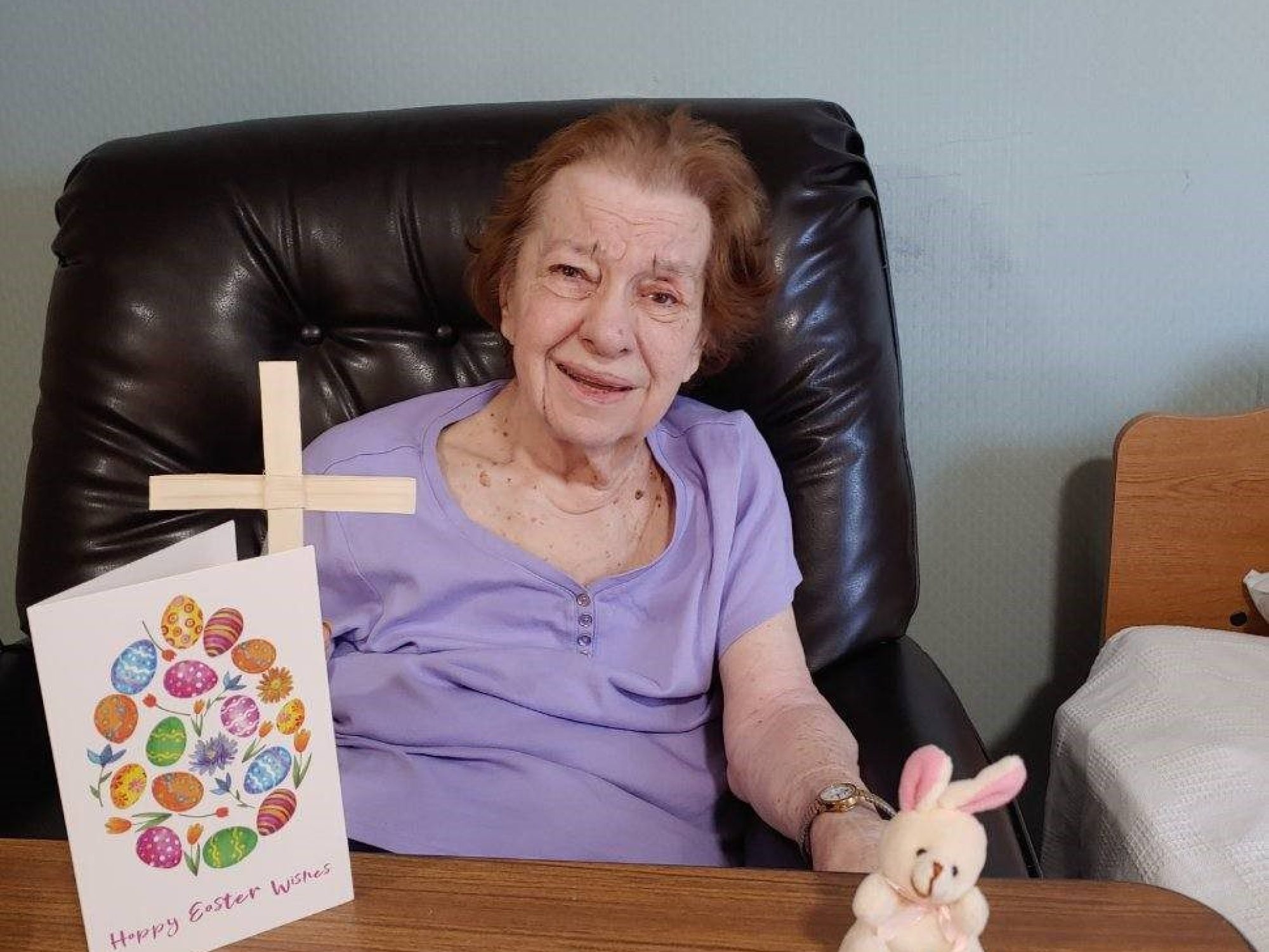 A resident in a purple shirt celebrates Easter.