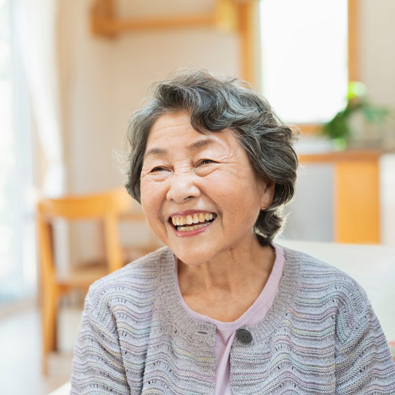 Happy elderly asian woman smiling