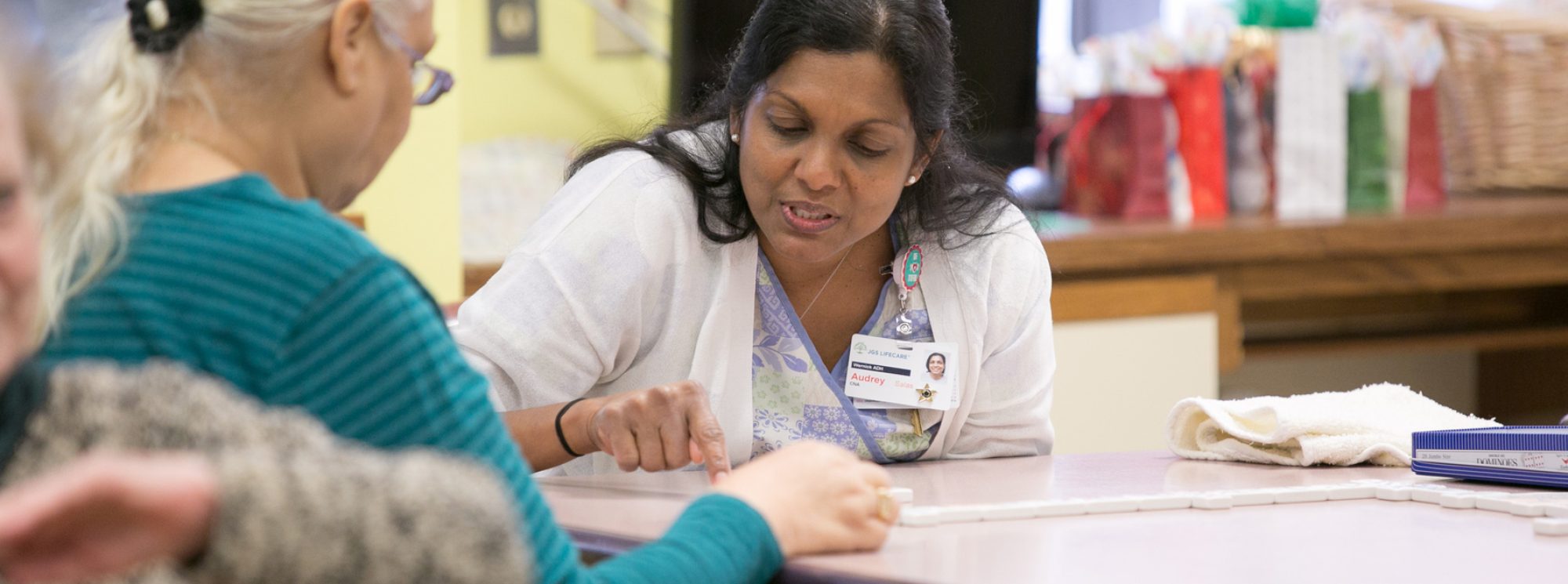 A JGS CNA working with a patient.