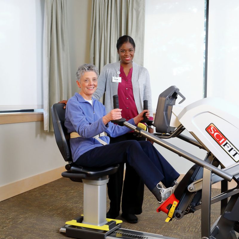 A resident using rehab equipment